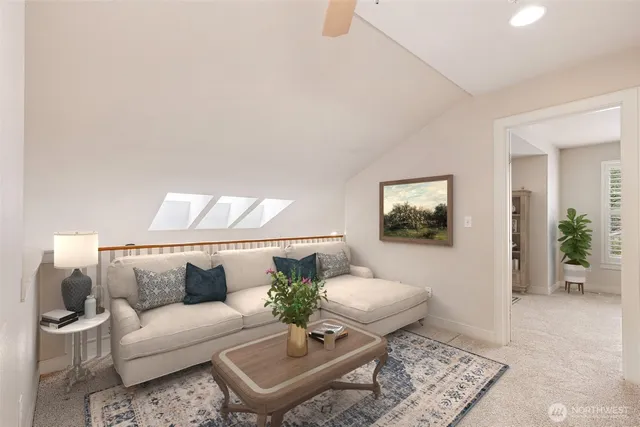 a living room with furniture and a rug