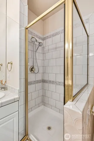 a bathroom with a bathtub and shower