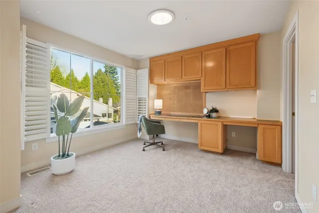 a car parked in front of white house