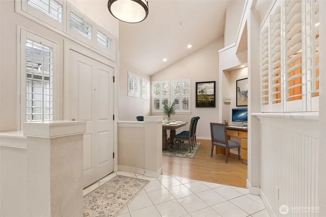 a view of a livingroom with furniture and a window