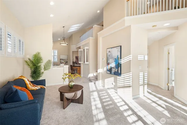 a living room with furniture and a rug