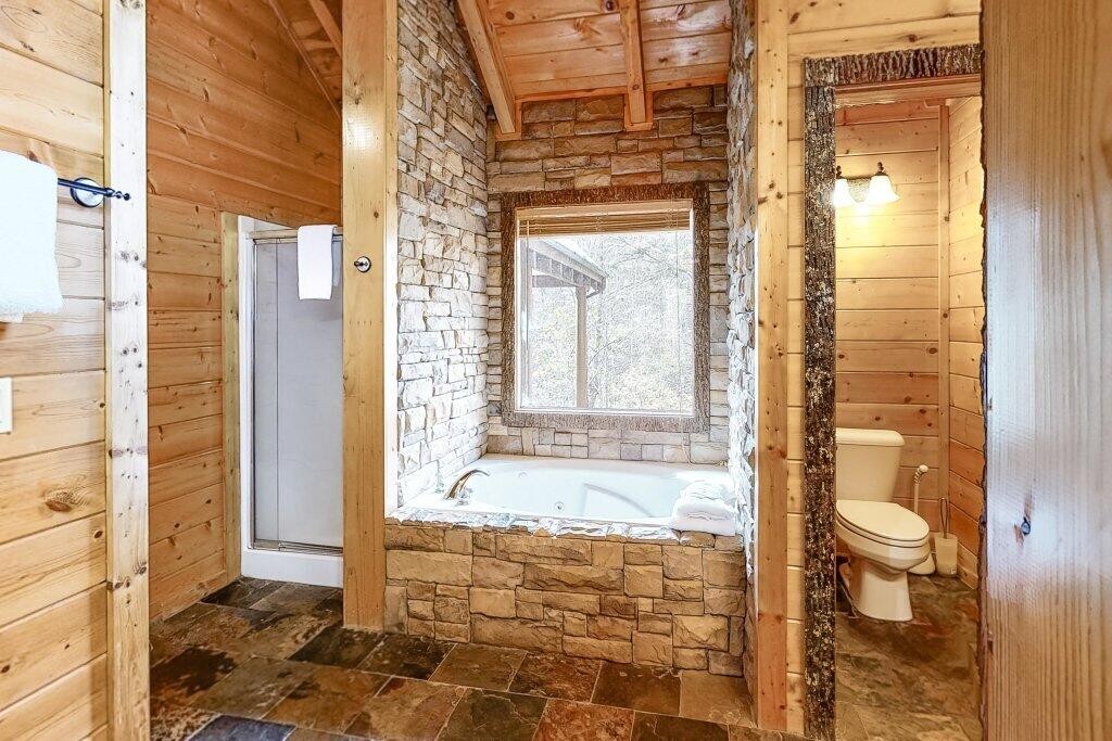 2556 Treehouse Lane Sevierville, TN 37876 - Photo 12 of 24 a bathroom with a granite countertop shower and a sink