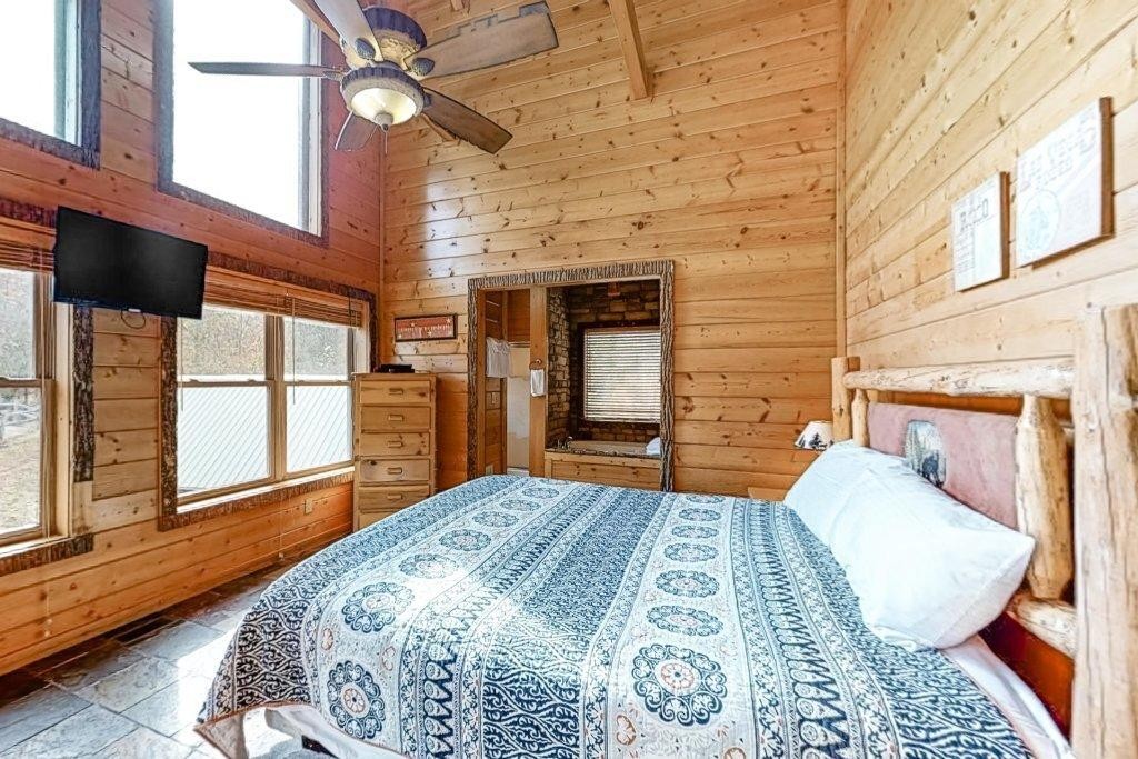 2556 Treehouse Lane Sevierville, TN 37876 - Photo 14 of 24 a bedroom with a bed and a window