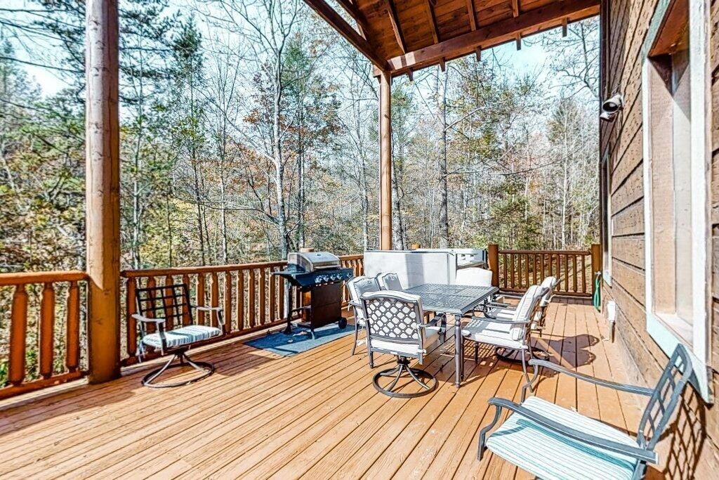 2556 Treehouse Lane Sevierville, TN 37876 - Photo 20 of 24 a view of a chairs and table on the deck
