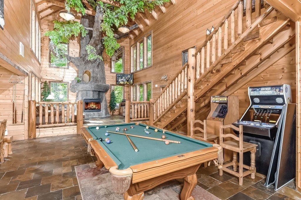 2556 Treehouse Lane Sevierville, TN 37876 - Photo 3 of 24 a view of a building with a backyard and chairs