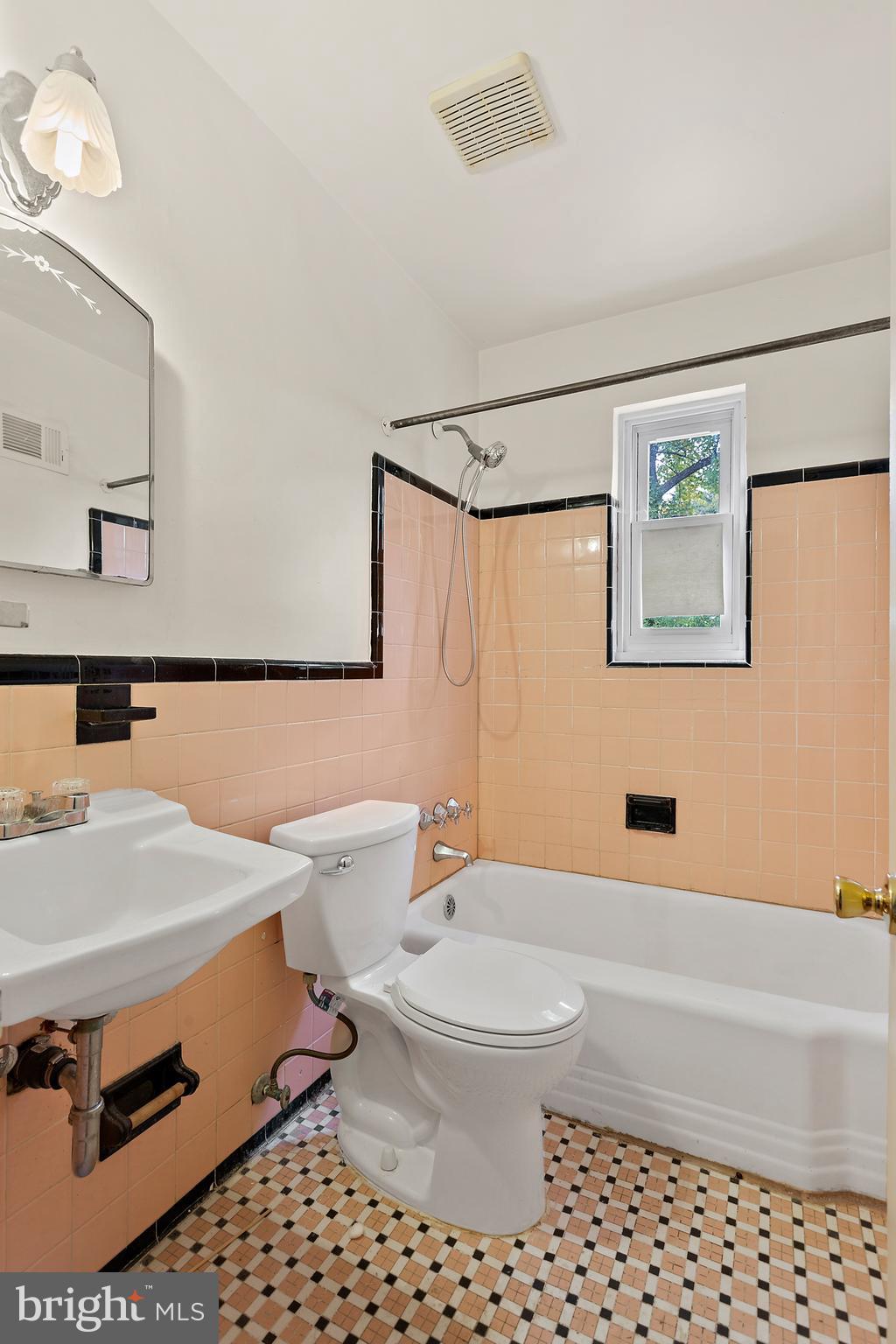 5913 Rolston Road Bethesda, MD 20817 - Photo 20 of 37 a bathroom with a sink toilet and shower