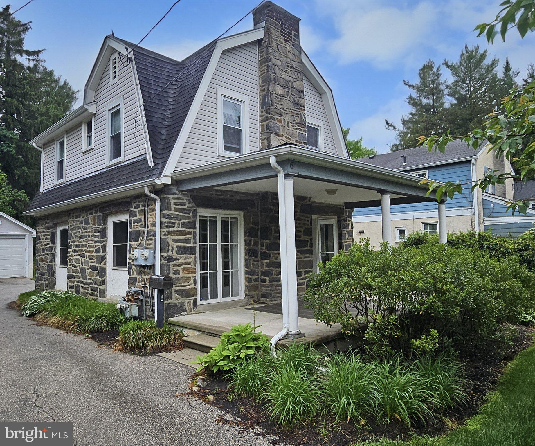 6 Arthur Road, Unit FRONT Rosemont, PA 19010 - Photo 22 of 24 Charming stone-front home with greenery.