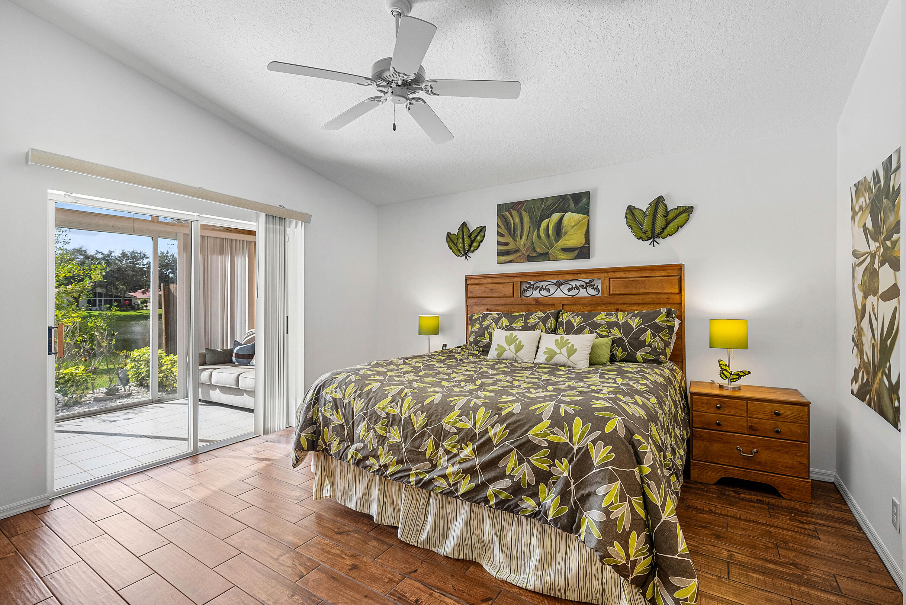 7304 Modena Drive Boynton Beach, FL 33437 - Photo 18 of 35 a bedroom with a bed and wooden floor