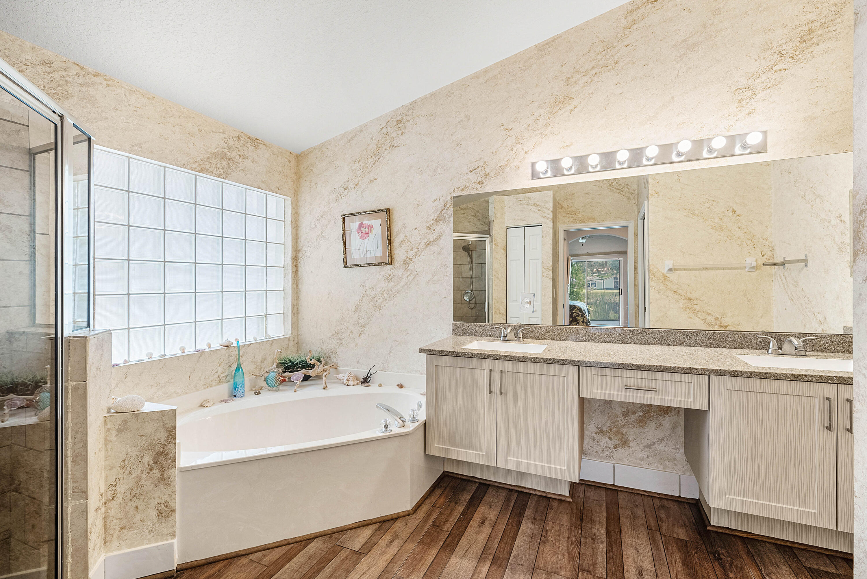 7304 Modena Drive Boynton Beach, FL 33437 - Photo 22 of 35 a bathroom with a bathtub and a sink