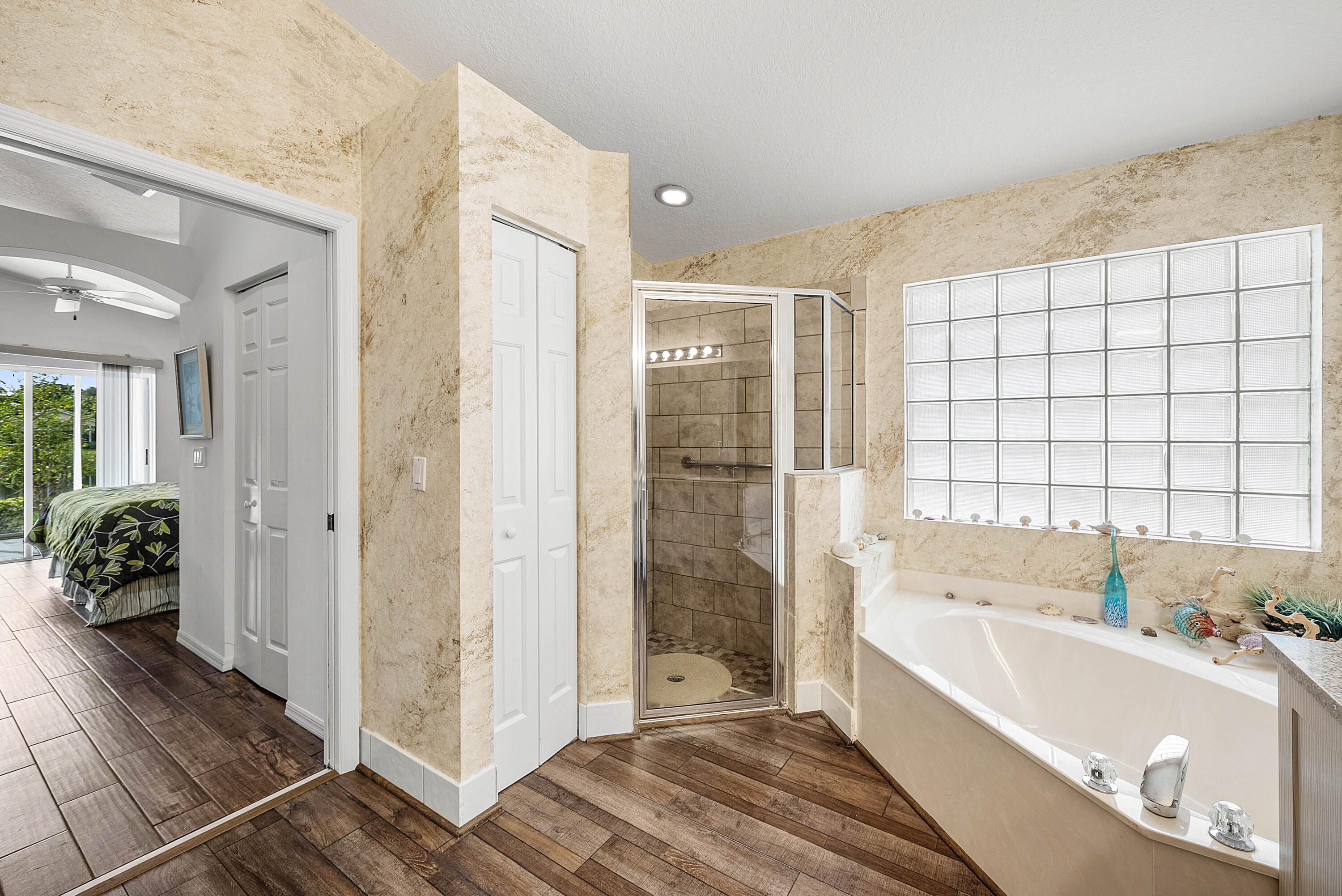 7304 Modena Drive Boynton Beach, FL 33437 - Photo 24 of 35 a bathroom with a tub shower and window