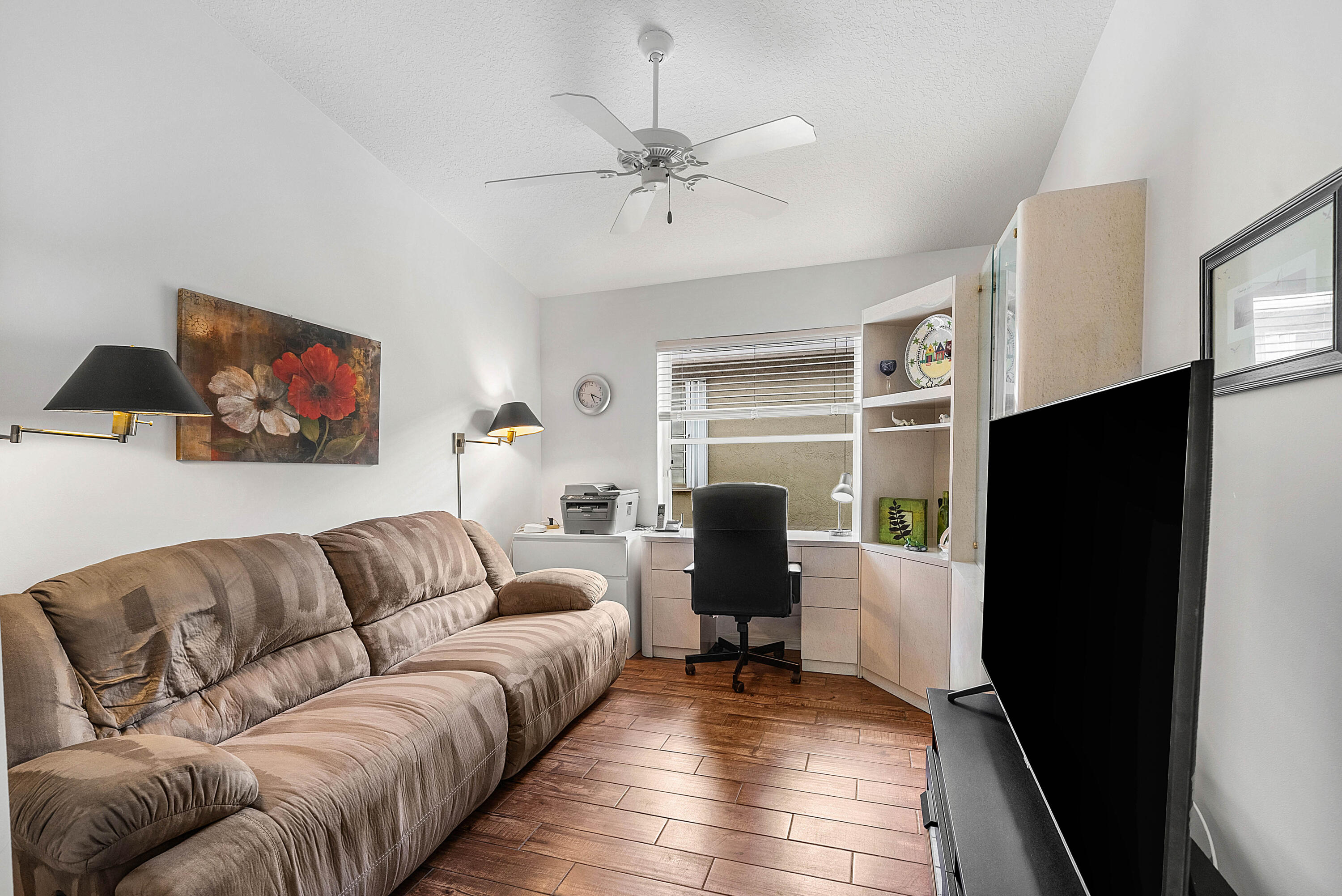 7304 Modena Drive Boynton Beach, FL 33437 - Photo 27 of 35 a living room with furniture and a flat screen tv