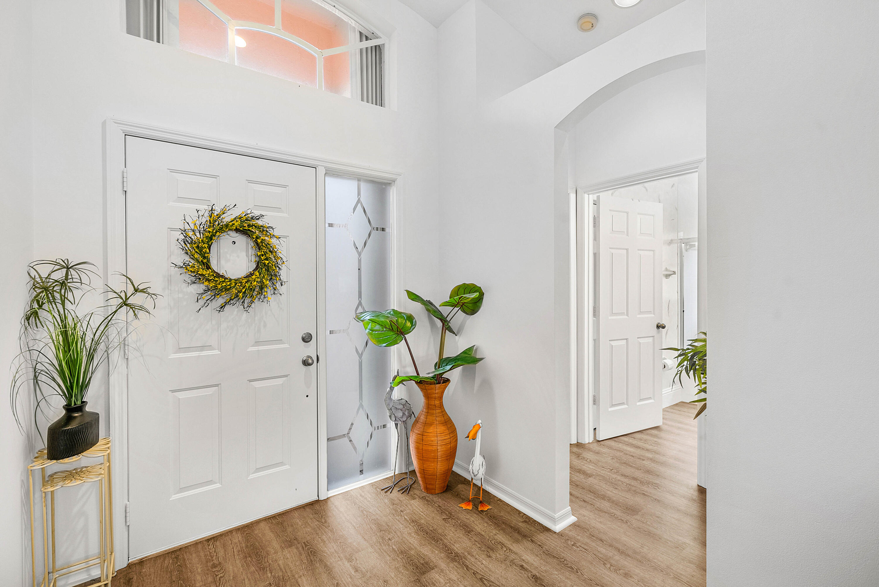 7304 Modena Drive Boynton Beach, FL 33437 - Photo 3 of 35 a view of hallway with wooden floor