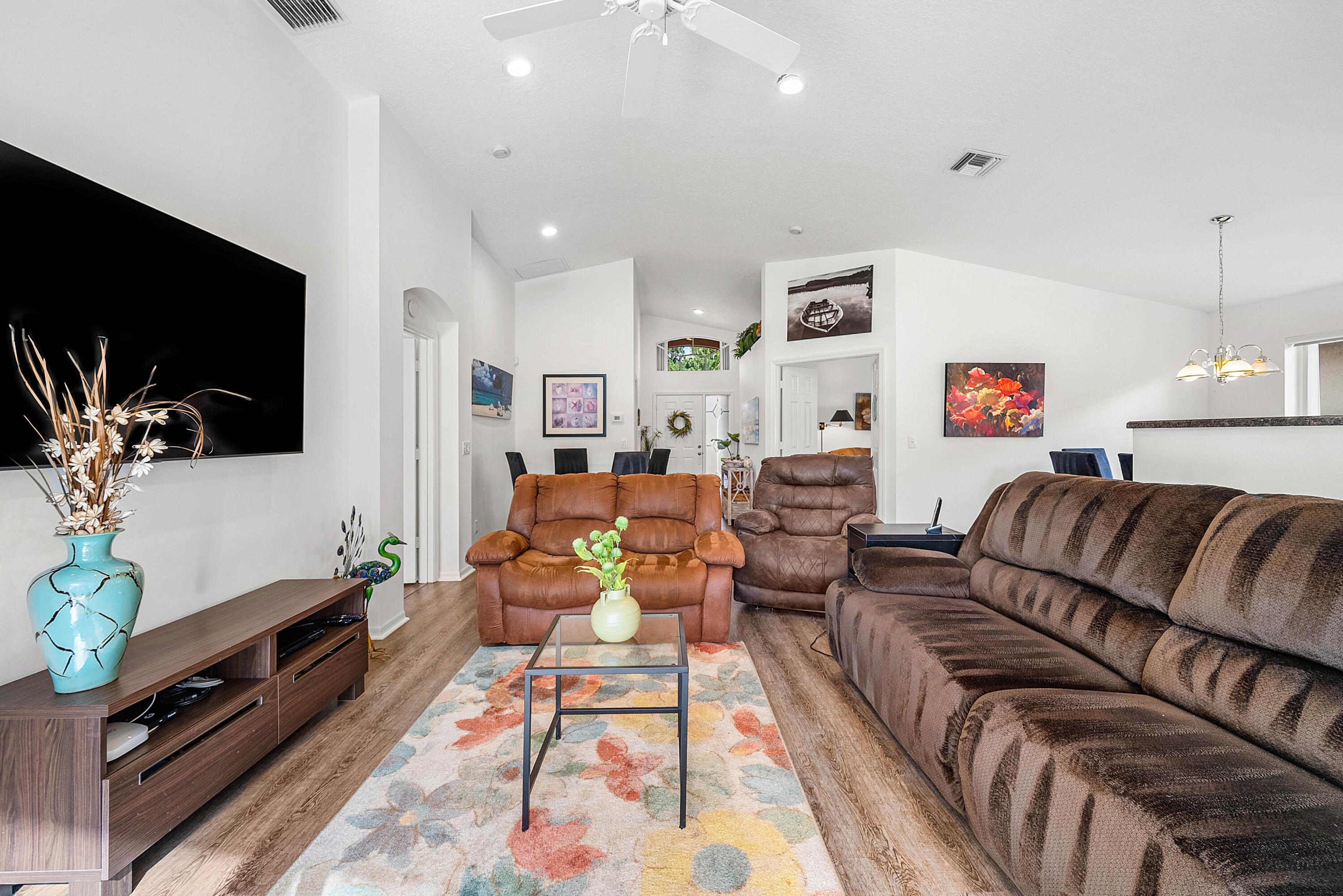 7304 Modena Drive Boynton Beach, FL 33437 - Photo 7 of 35 a living room with furniture and a flat screen tv