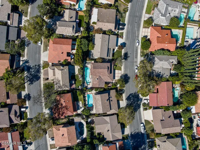 an aerial view of houses with outdoor space