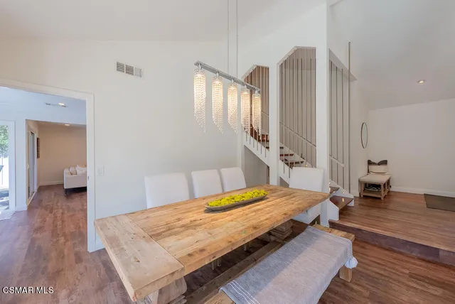 a bedroom with a bed and a table