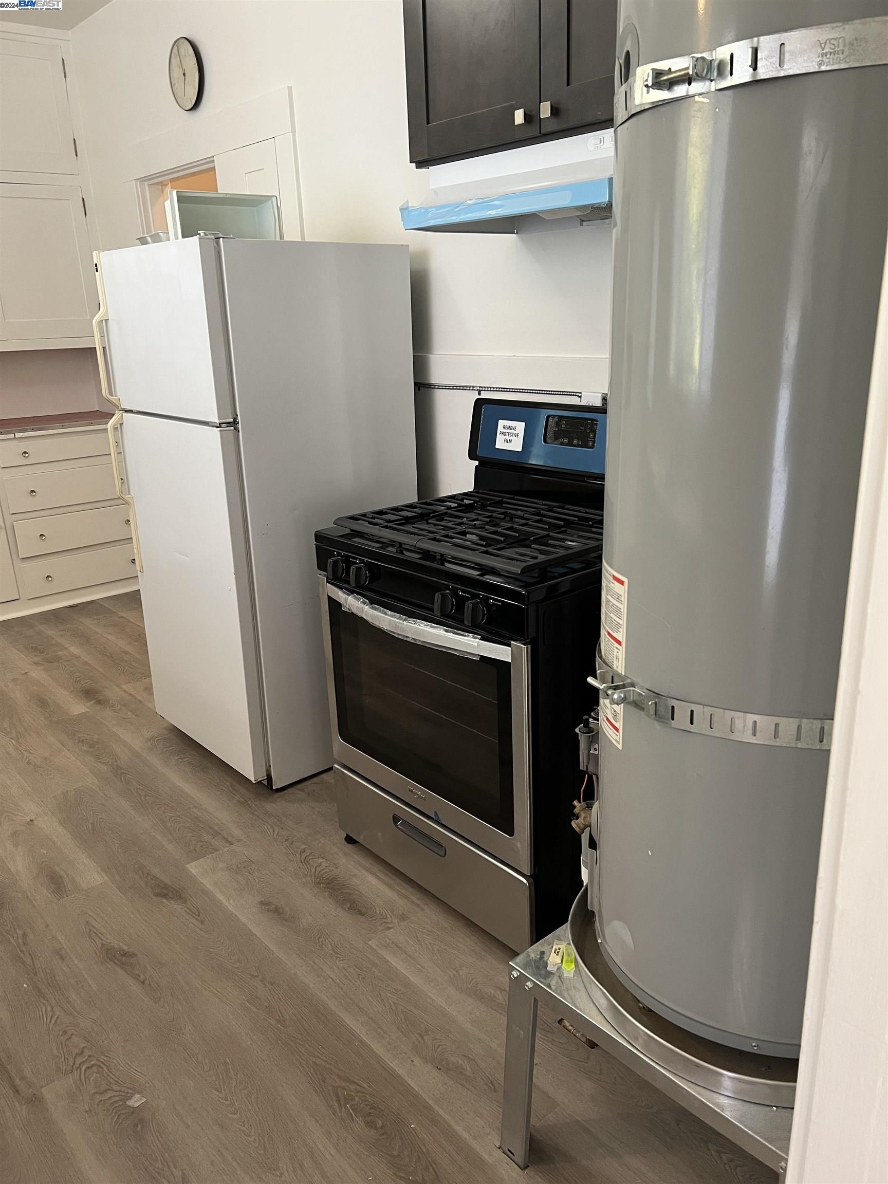 2418 Ashby Avenue, Unit # 2 Berkeley, CA 94705 - Photo 11 of 15 a stove top oven sitting inside of a kitchen