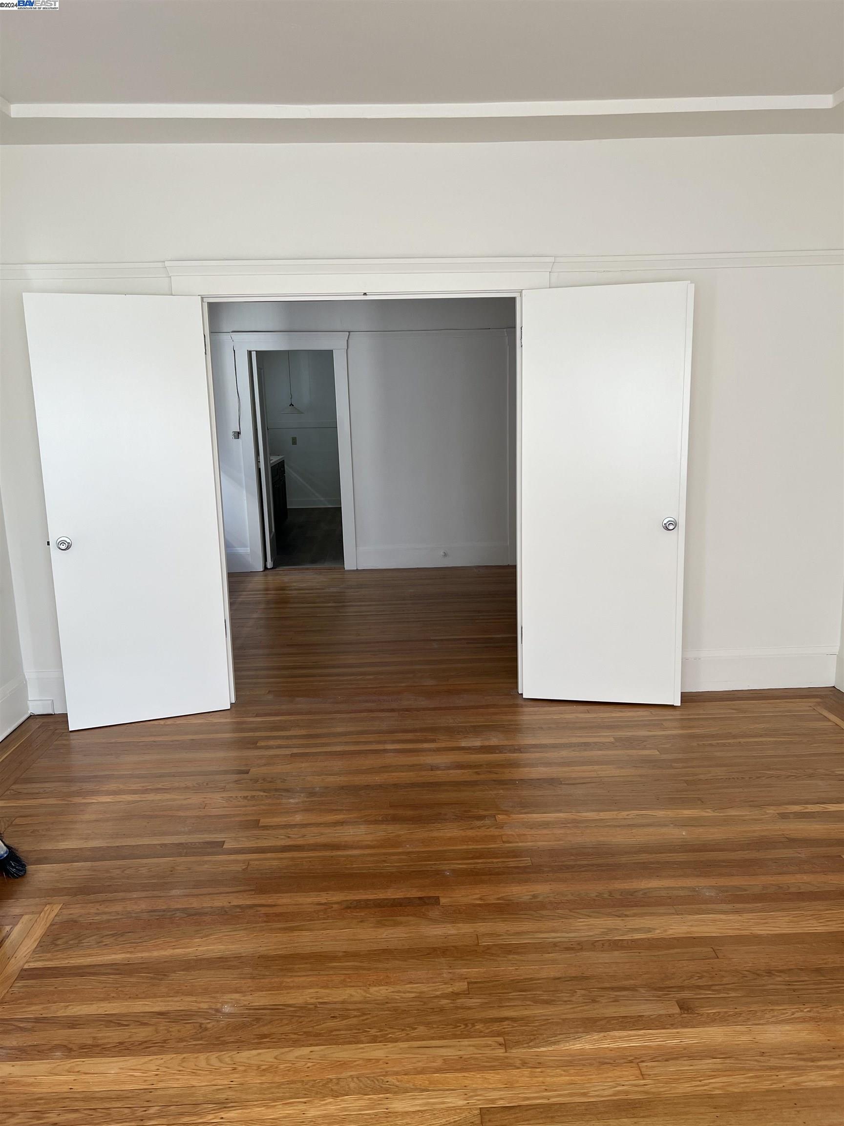 2418 Ashby Avenue, Unit # 2 Berkeley, CA 94705 - Photo 4 of 15 a view of a hallway with wooden floor