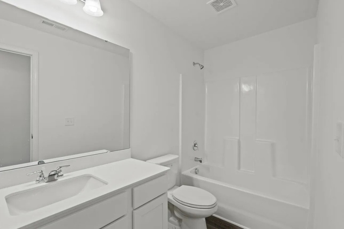 31107 Gayle Prairie Oaks Street Waller, TX 77484 - Photo 13 of 15 a bathroom with a sink a toilet and shower