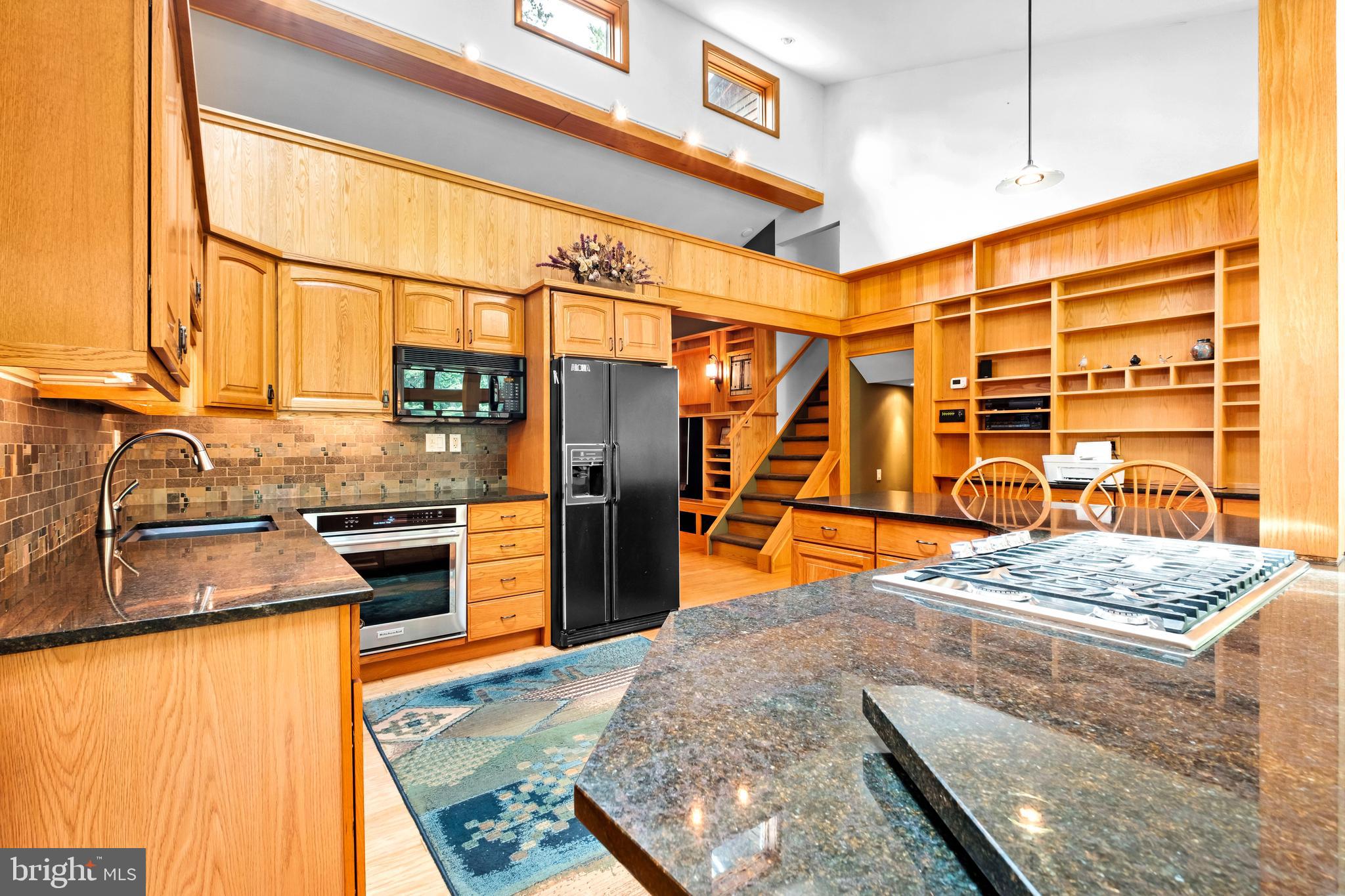 46 Grassy Lake Road Shamong, NJ 08088 - Photo 12 of 47 a kitchen with stainless steel appliances kitchen island granite countertop a stove and refrigerator