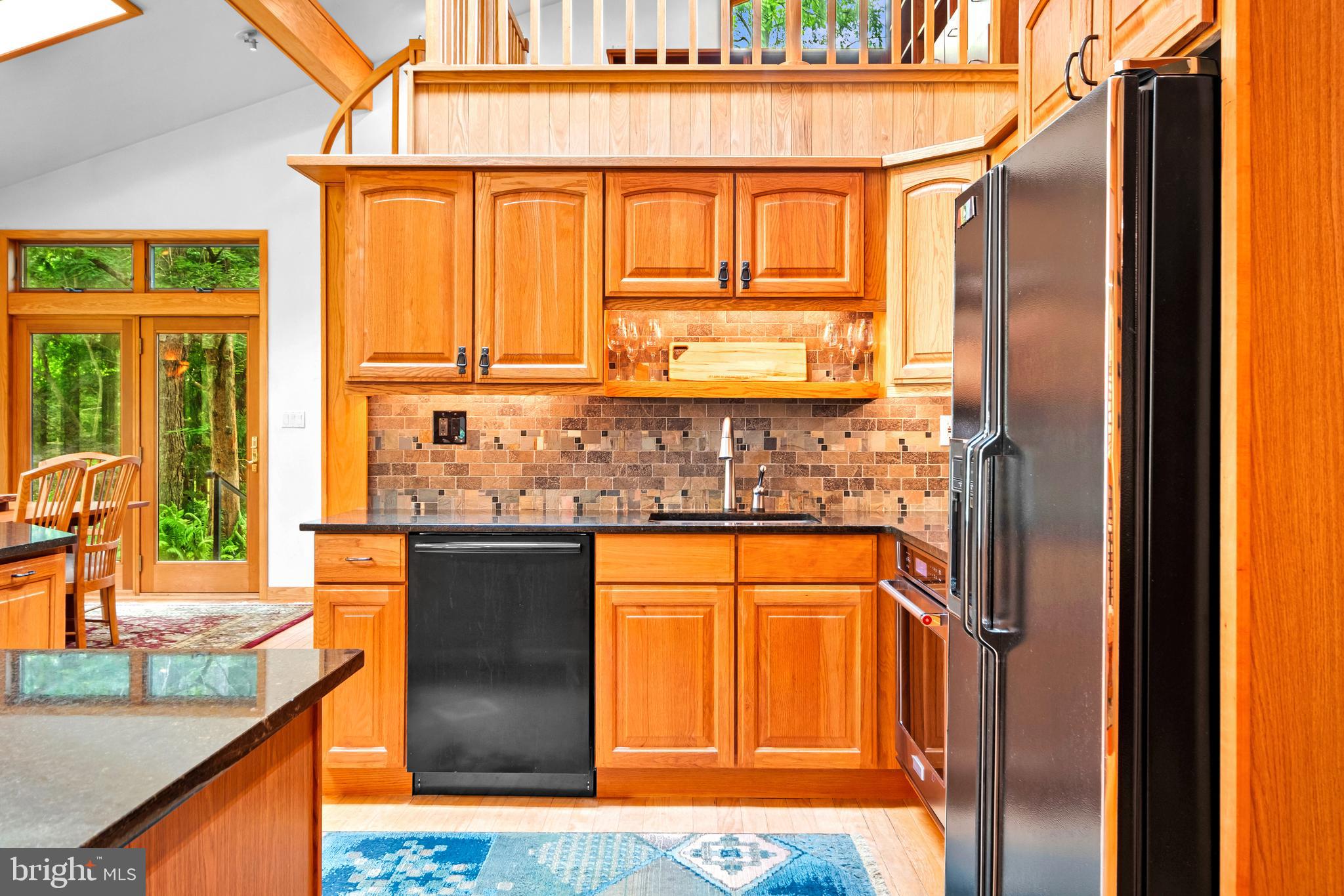 46 Grassy Lake Road Shamong, NJ 08088 - Photo 14 of 47 a kitchen with stainless steel appliances granite countertop a refrigerator and a sink