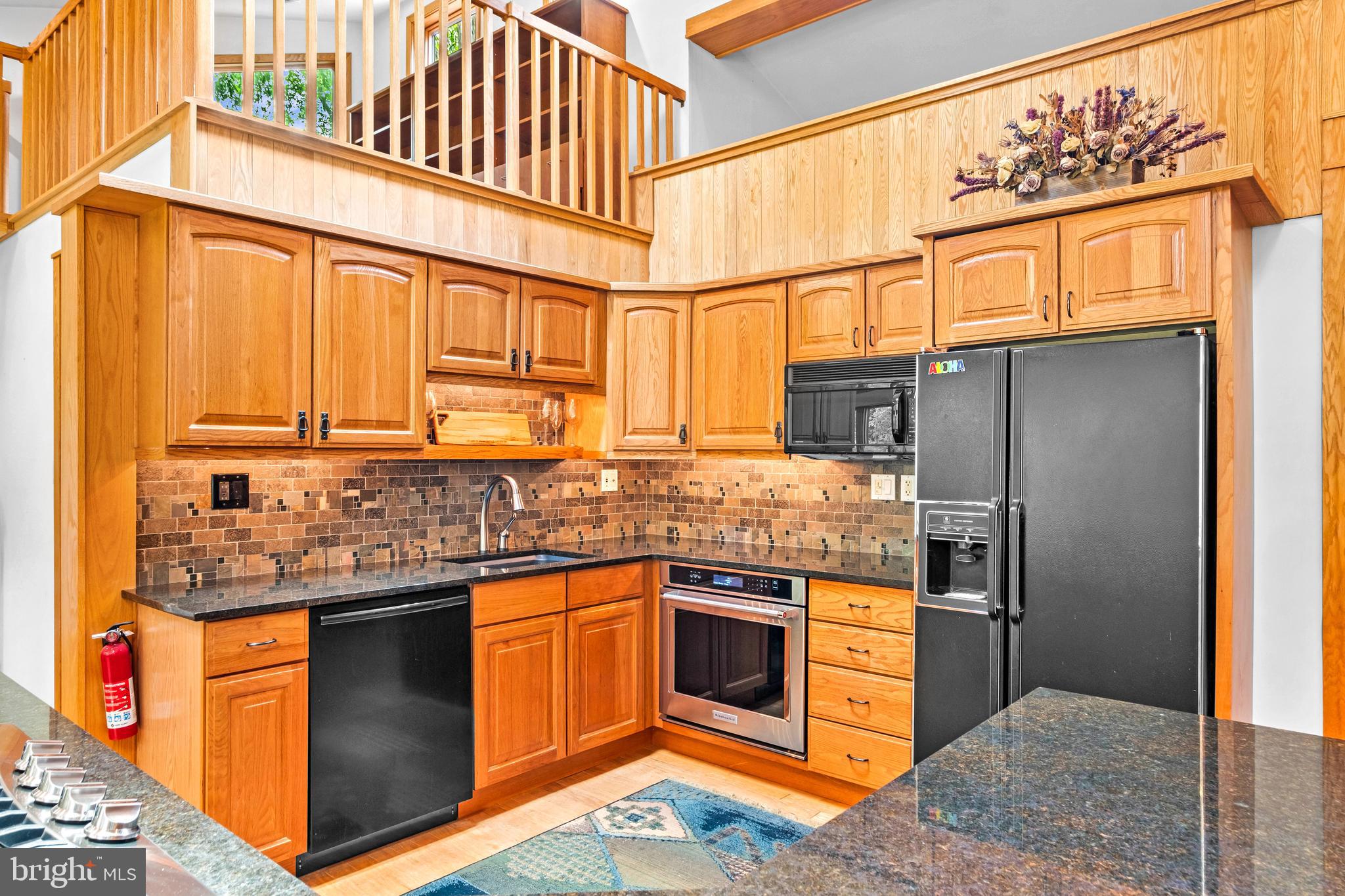 46 Grassy Lake Road Shamong, NJ 08088 - Photo 15 of 47 a kitchen with stainless steel appliances granite countertop a sink stove and refrigerator