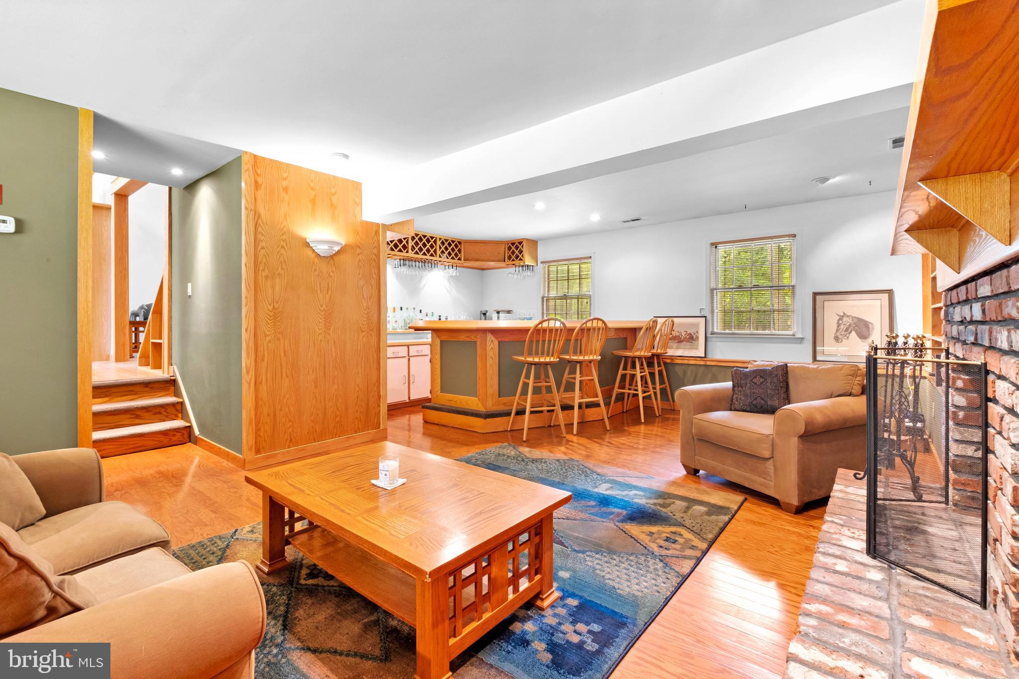 46 Grassy Lake Road Shamong, NJ 08088 - Photo 23 of 47 a living room with furniture a rug and a chandelier