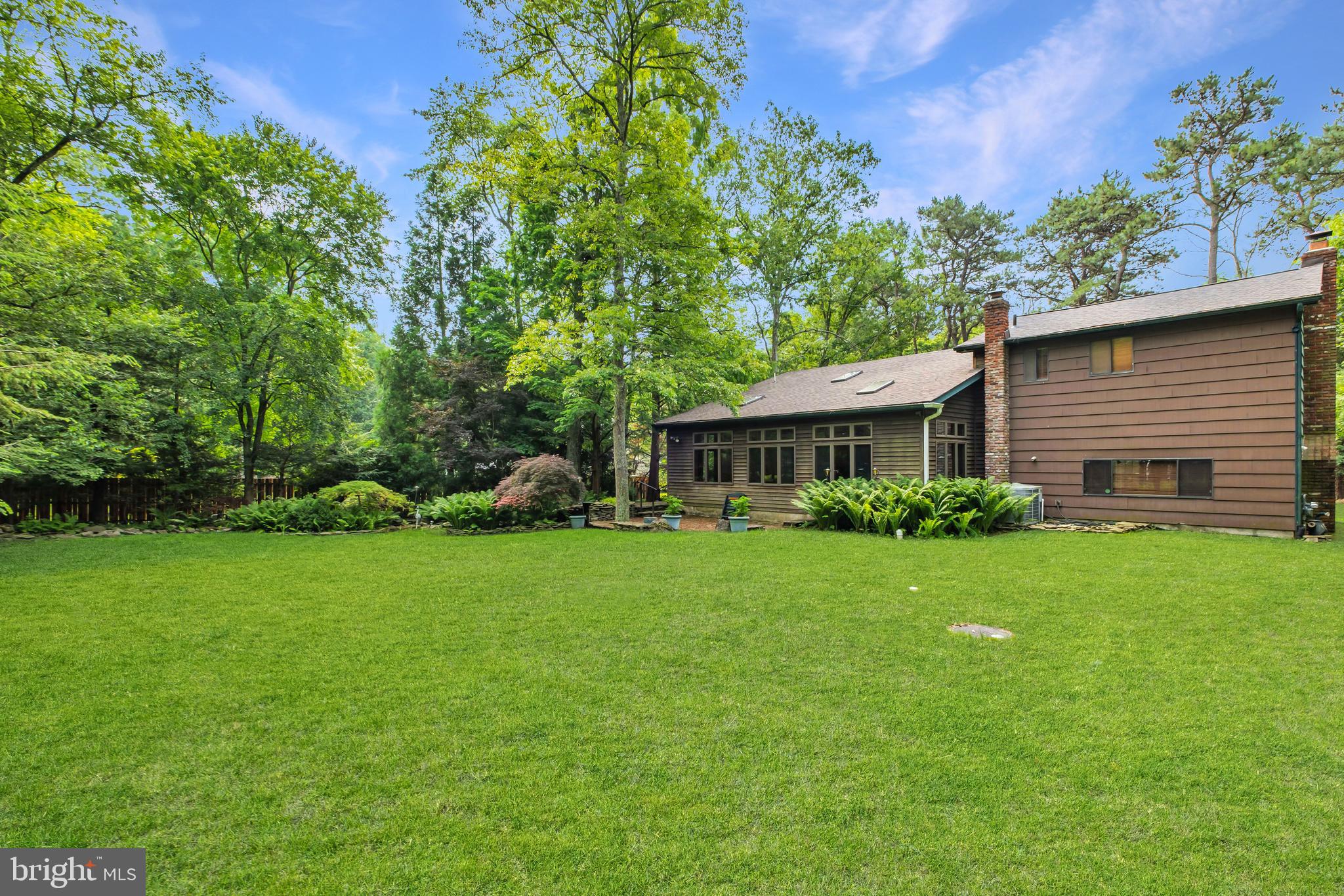 46 Grassy Lake Road Shamong, NJ 08088 - Photo 39 of 47 a front view of a house with a garden