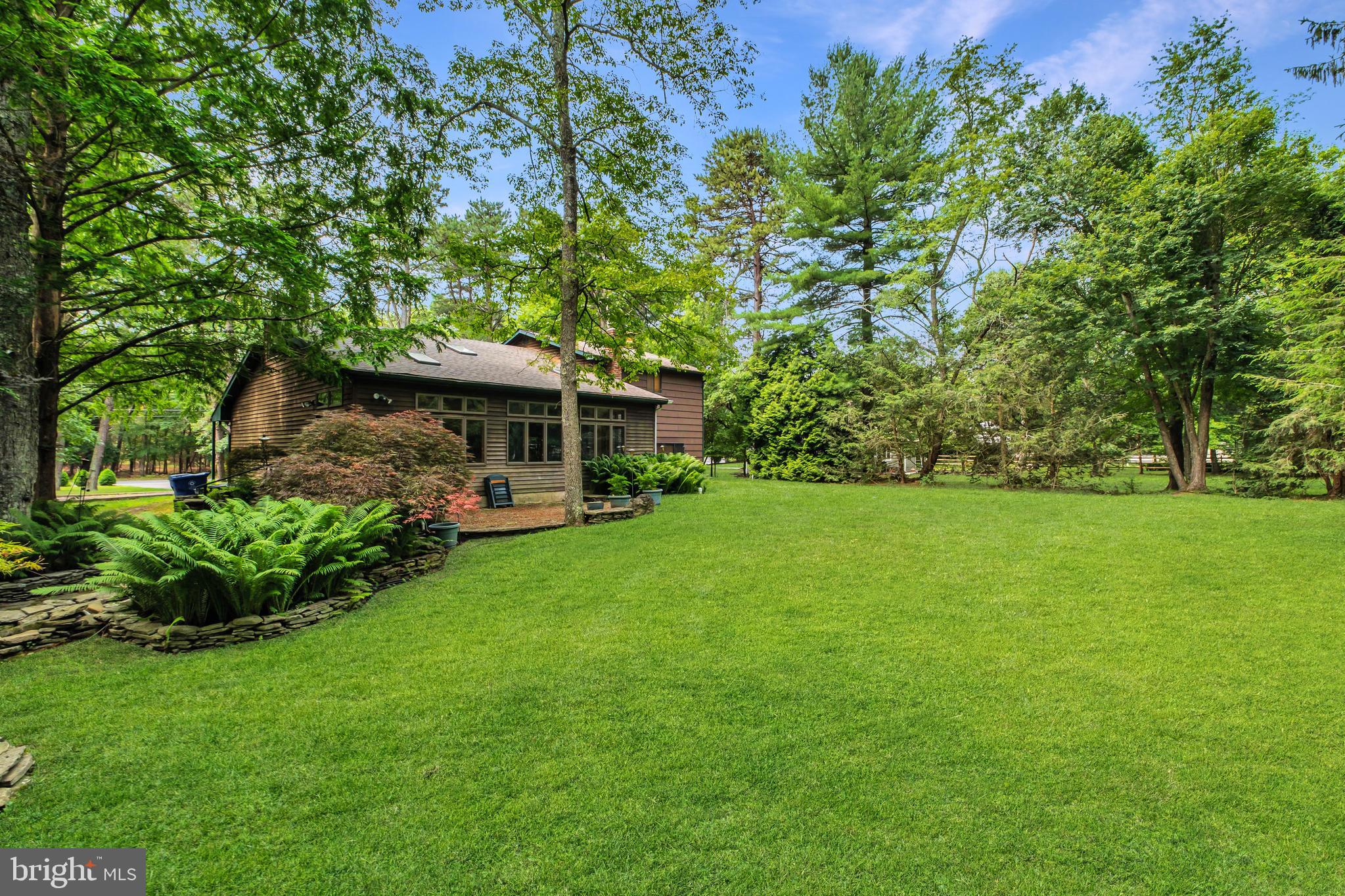 46 Grassy Lake Road Shamong, NJ 08088 - Photo 45 of 47 a front view of a house with garden