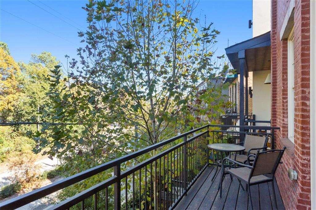 a view of a balcony with chairs