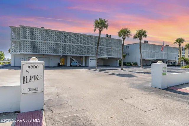 a view of a swimming pool with an outdoor space and seating area