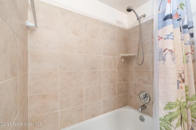 a bathroom with a granite countertop toilet sink and mirror