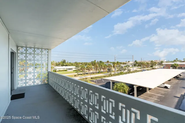 a view of balcony with furniture