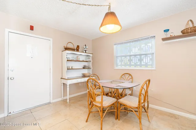 a kitchen with stainless steel appliances granite countertop a stove a sink dishwasher and a microwave oven with cabinets