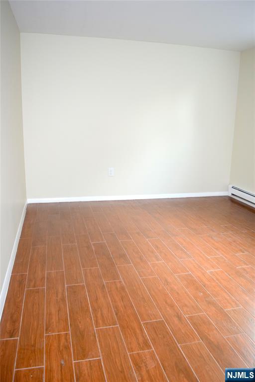 533 Roff Avenue Palisades Park, NJ 07650 - Photo 13 of 16 a view of an empty room with wooden floor