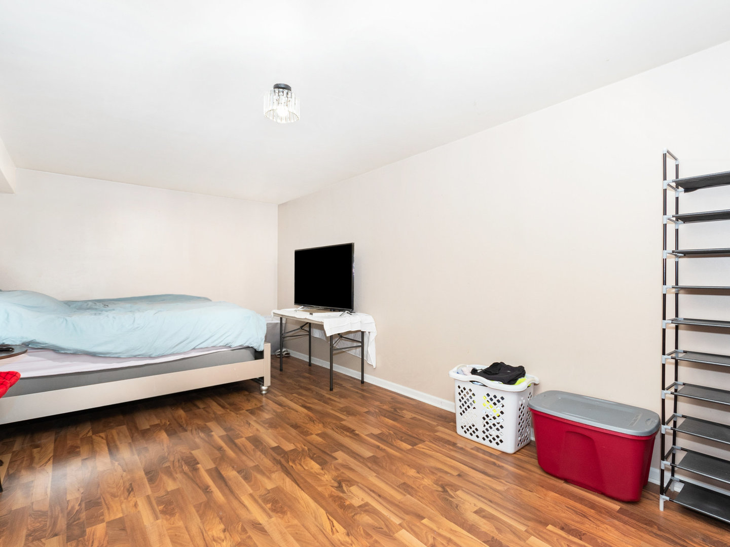 5519 Stonybrook Drive Plainfield, IL 60586 - Photo 13 of 27 a living room with furniture and a flat screen tv