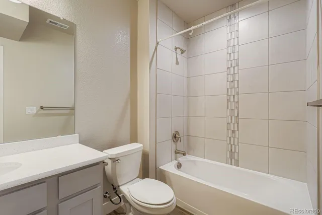 a bathroom with a sink a toilet and a bathtub