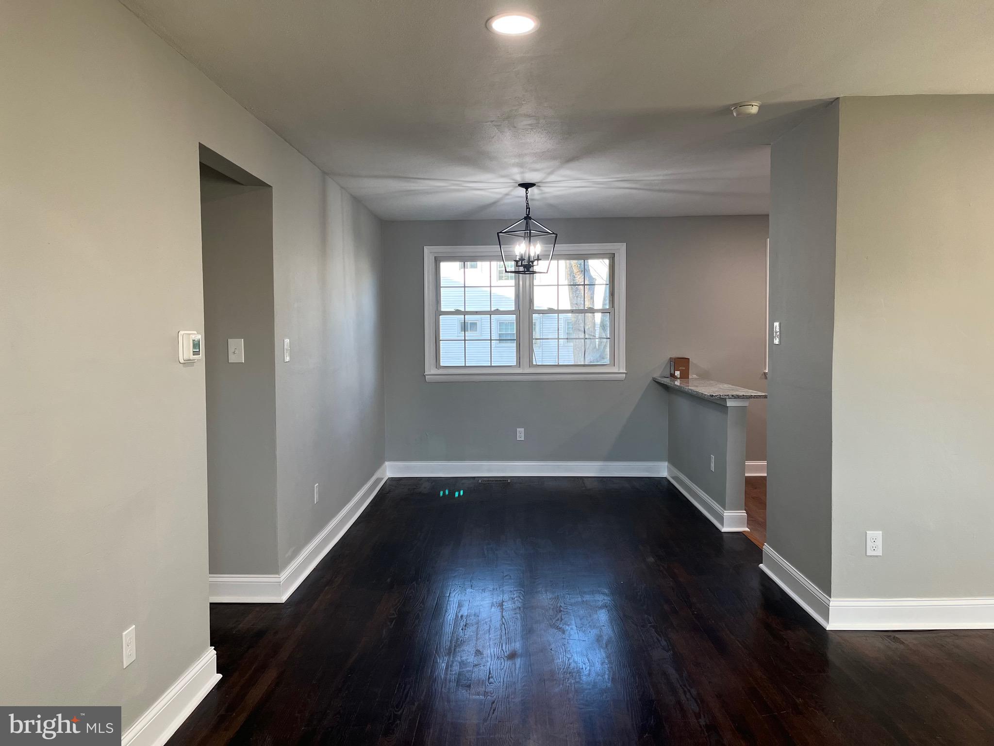 491 Prospect Road Warminster, PA 18974 - Photo 8 of 51 an empty room with wooden floor and windows