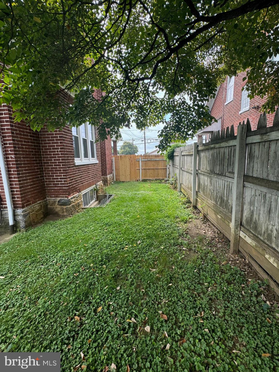 885 Manor Street Lancaster, PA 17603 - Photo 10 of 13 a view of a backyard with a tree