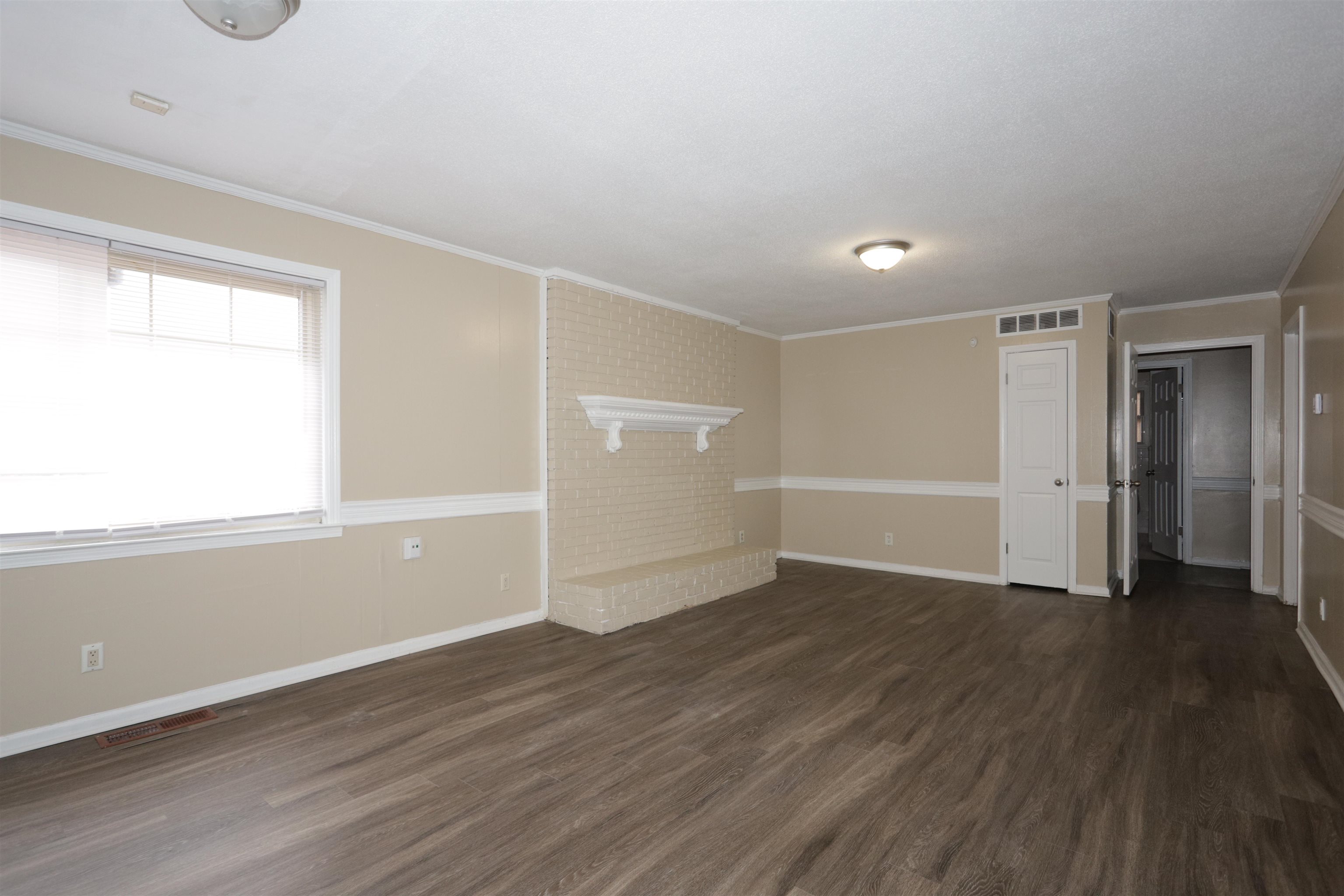 3272 Powers Road Memphis, TN 38128 - Photo 11 of 23 wooden floor in an empty room with a window