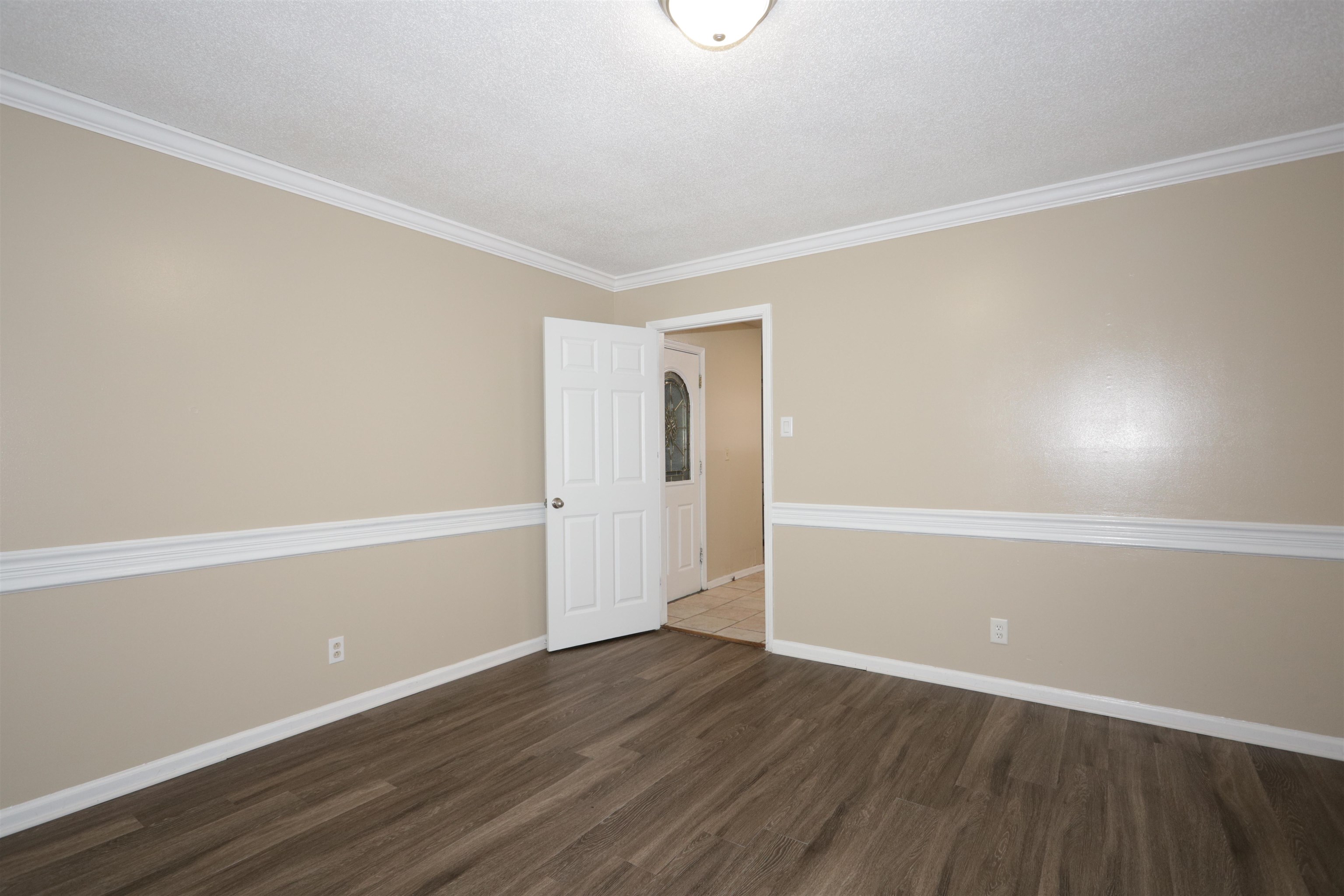 3272 Powers Road Memphis, TN 38128 - Photo 13 of 23 a view of an empty room with wooden floor