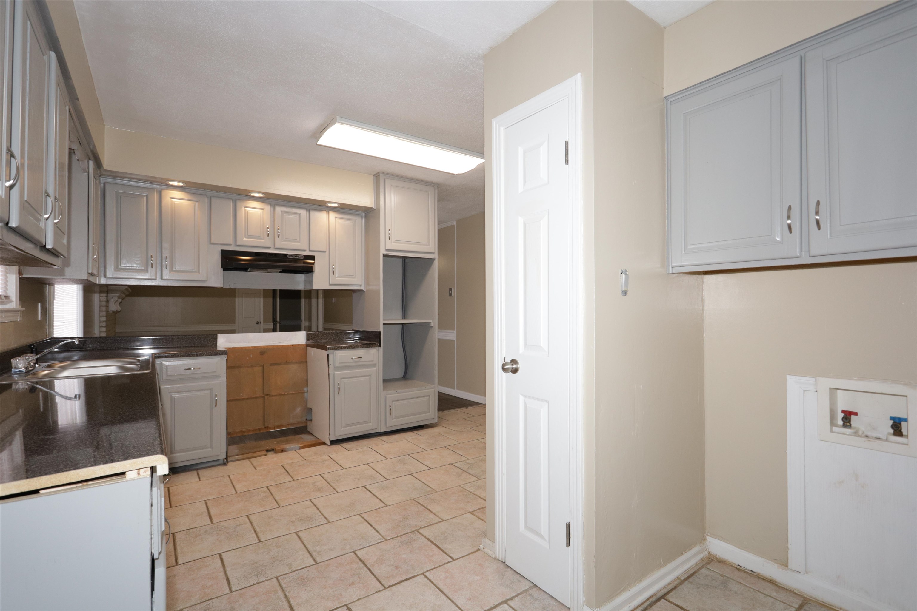 3272 Powers Road Memphis, TN 38128 - Photo 15 of 23 a kitchen with a refrigerator and a stove top oven