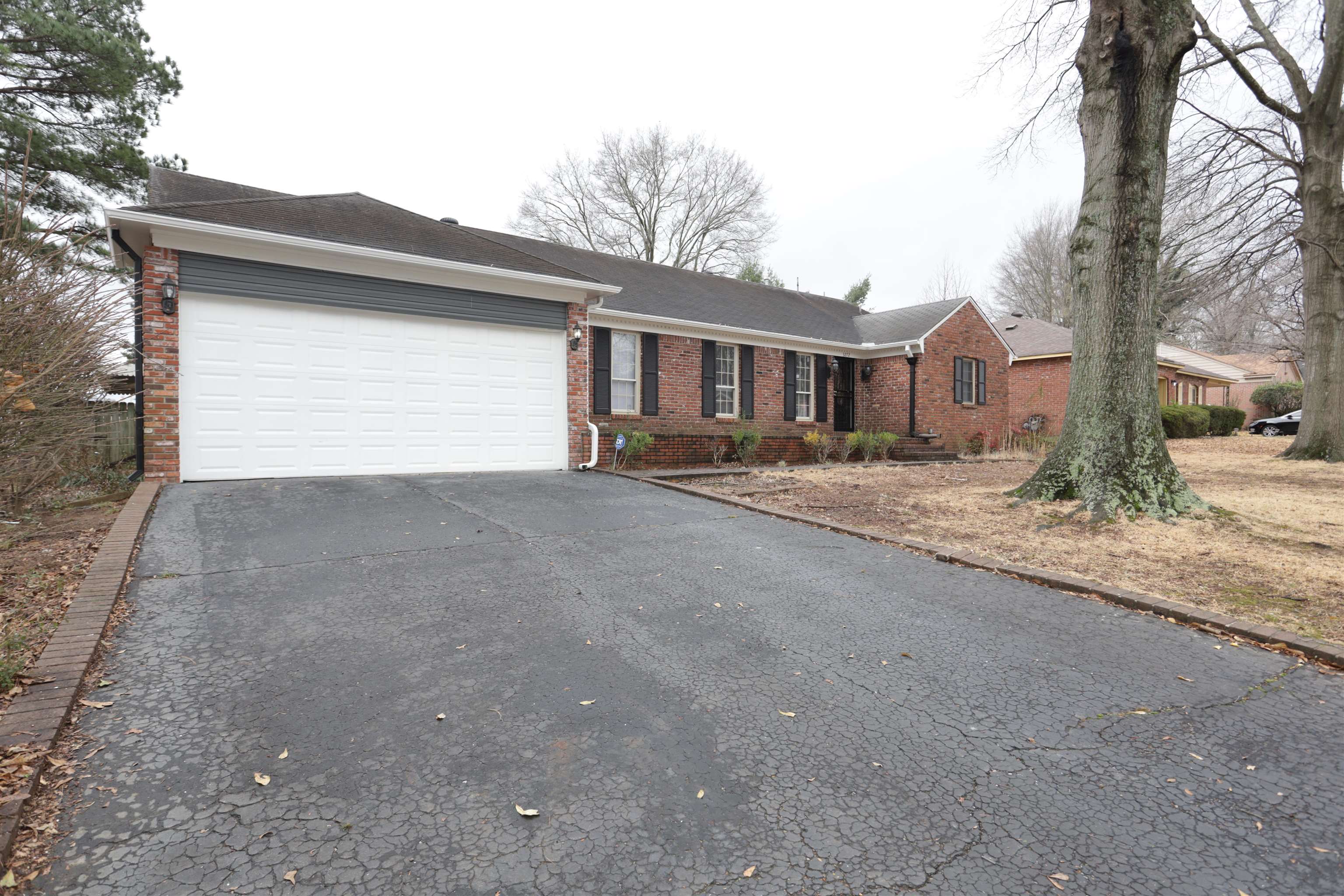 3272 Powers Road Memphis, TN 38128 - Photo 2 of 23 a front view of a house with a yard