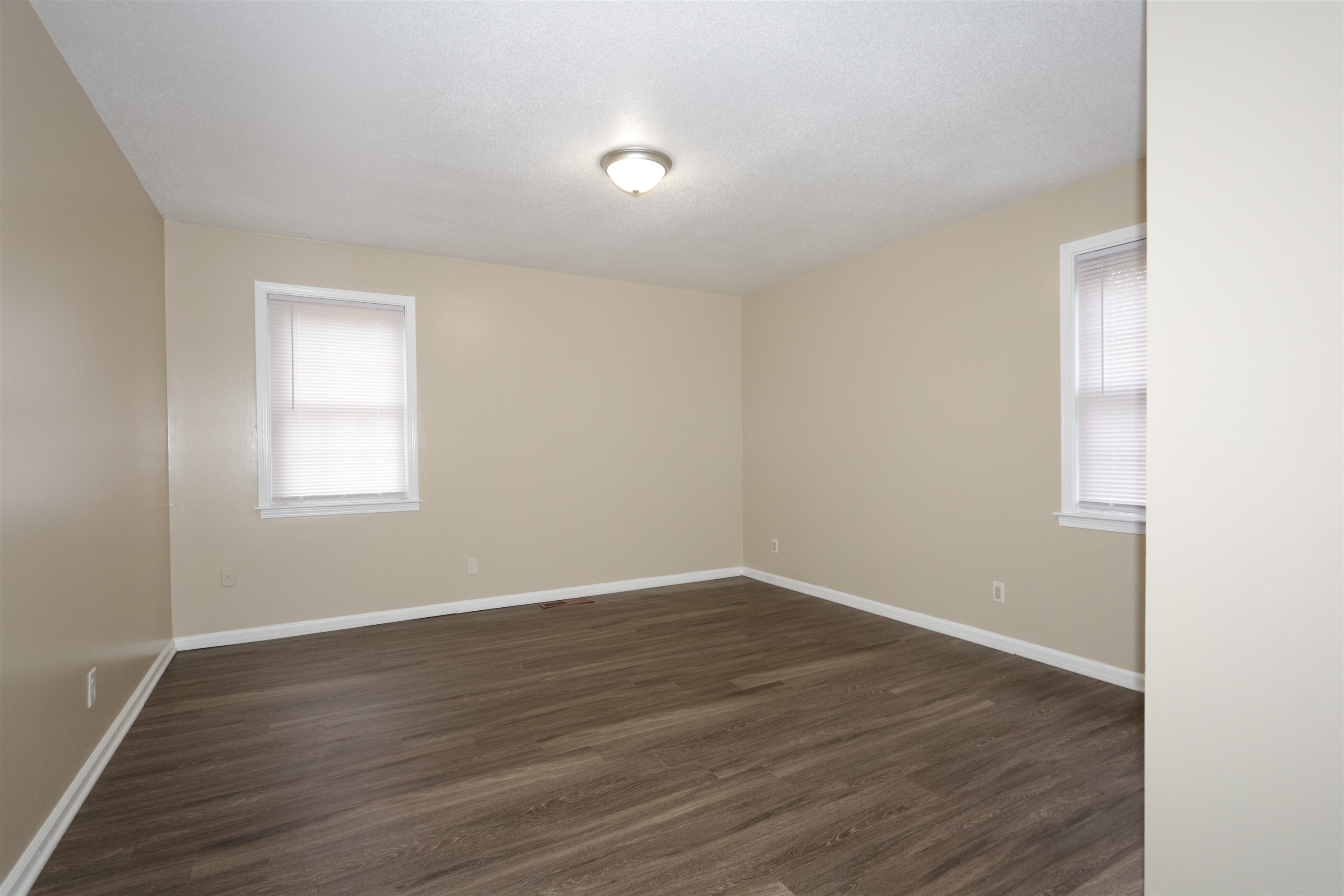 3272 Powers Road Memphis, TN 38128 - Photo 23 of 23 an empty room with wooden floor and windows