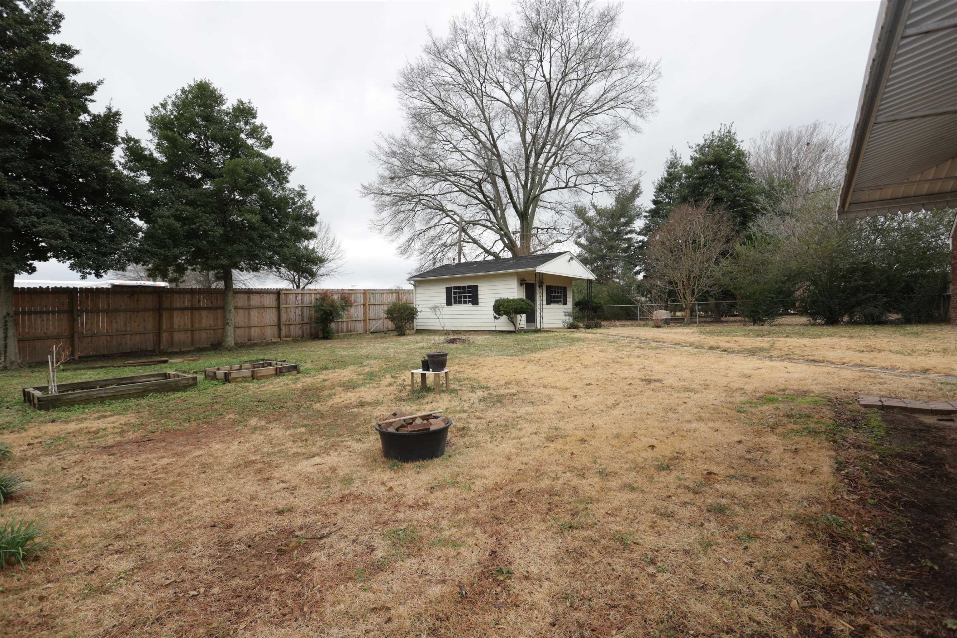 3272 Powers Road Memphis, TN 38128 - Photo 3 of 23 a fire hydrant in the middle of a yard
