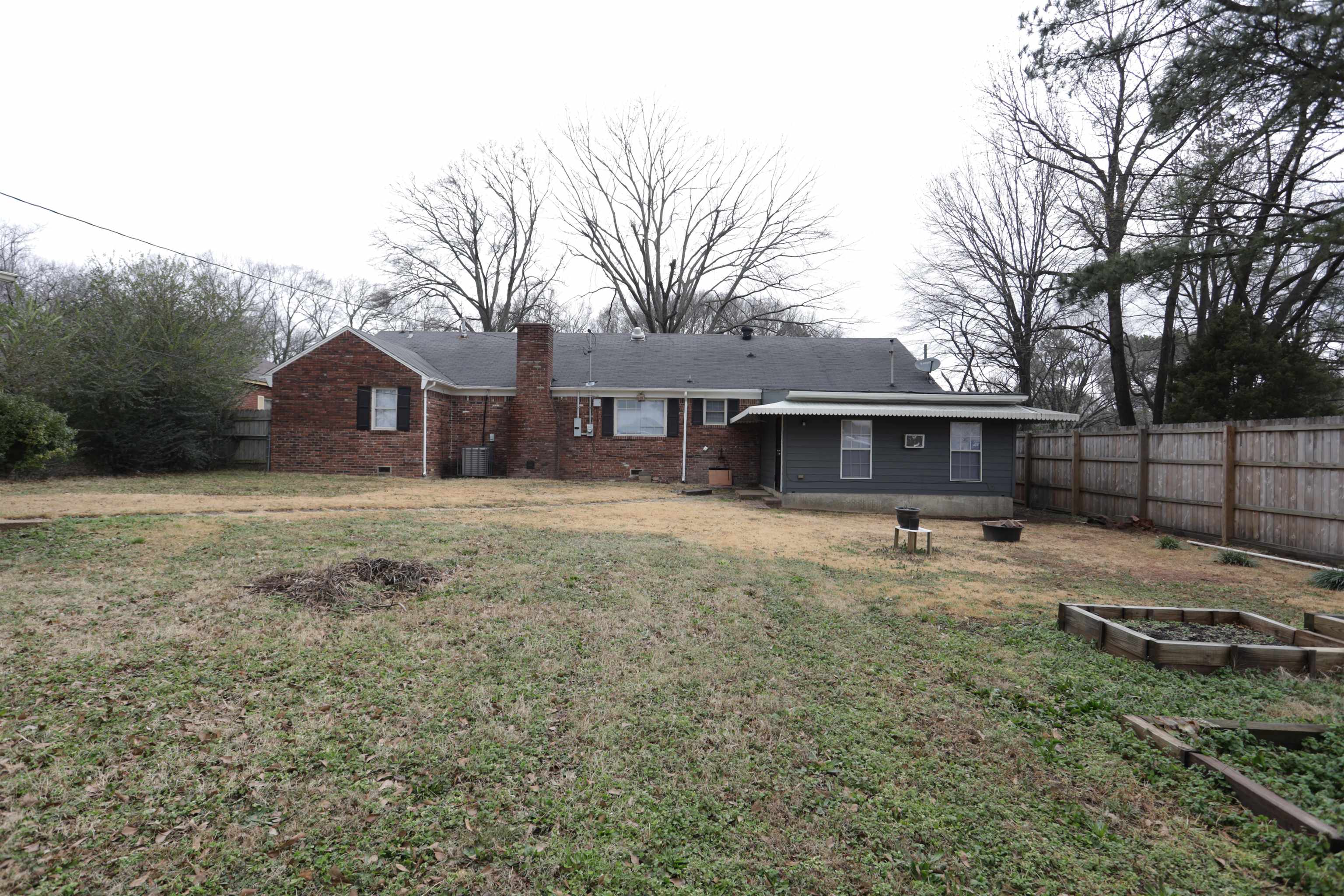 3272 Powers Road Memphis, TN 38128 - Photo 4 of 23 a view of a house with a yard