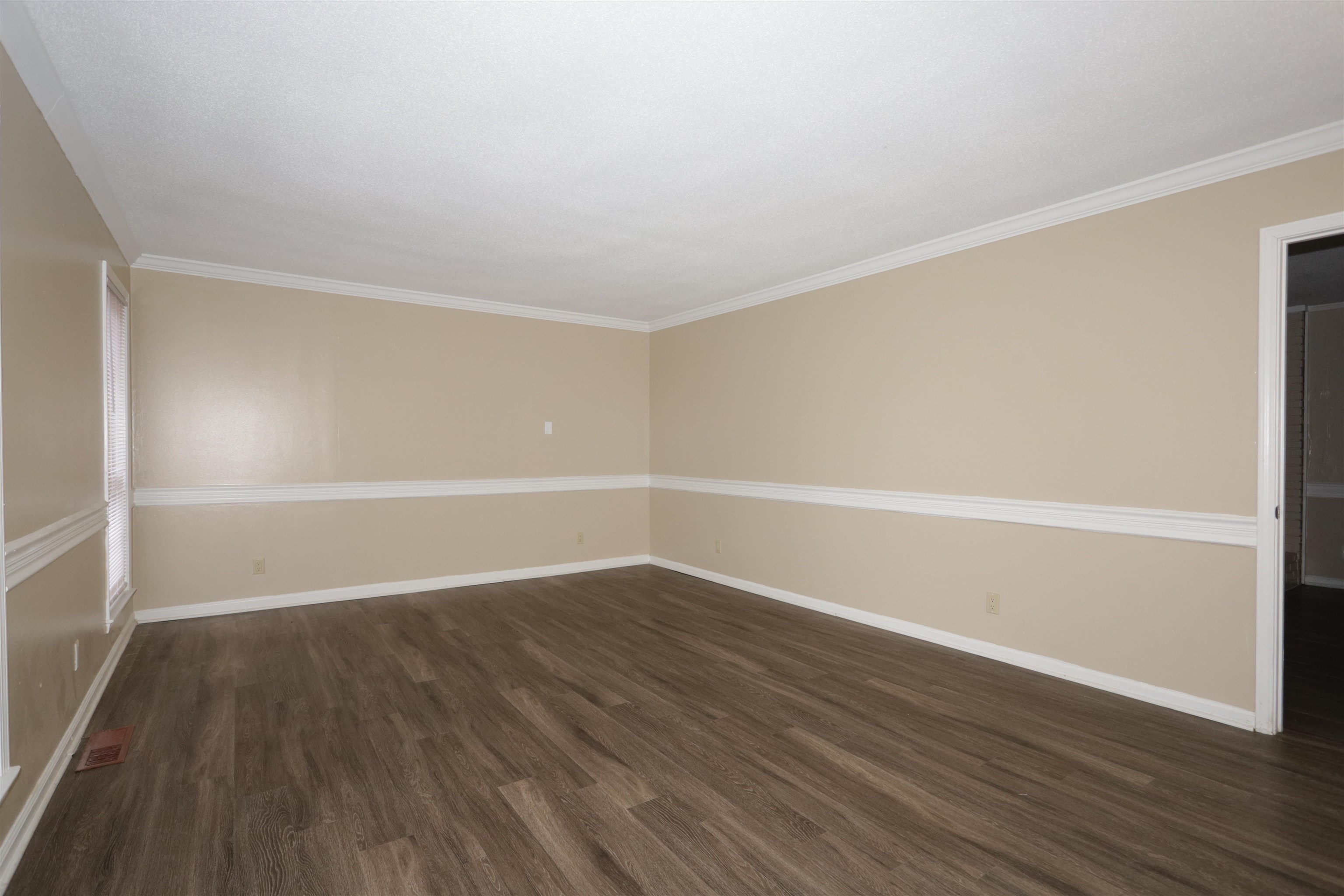 3272 Powers Road Memphis, TN 38128 - Photo 8 of 23 a view of an empty room with wooden floor and a window