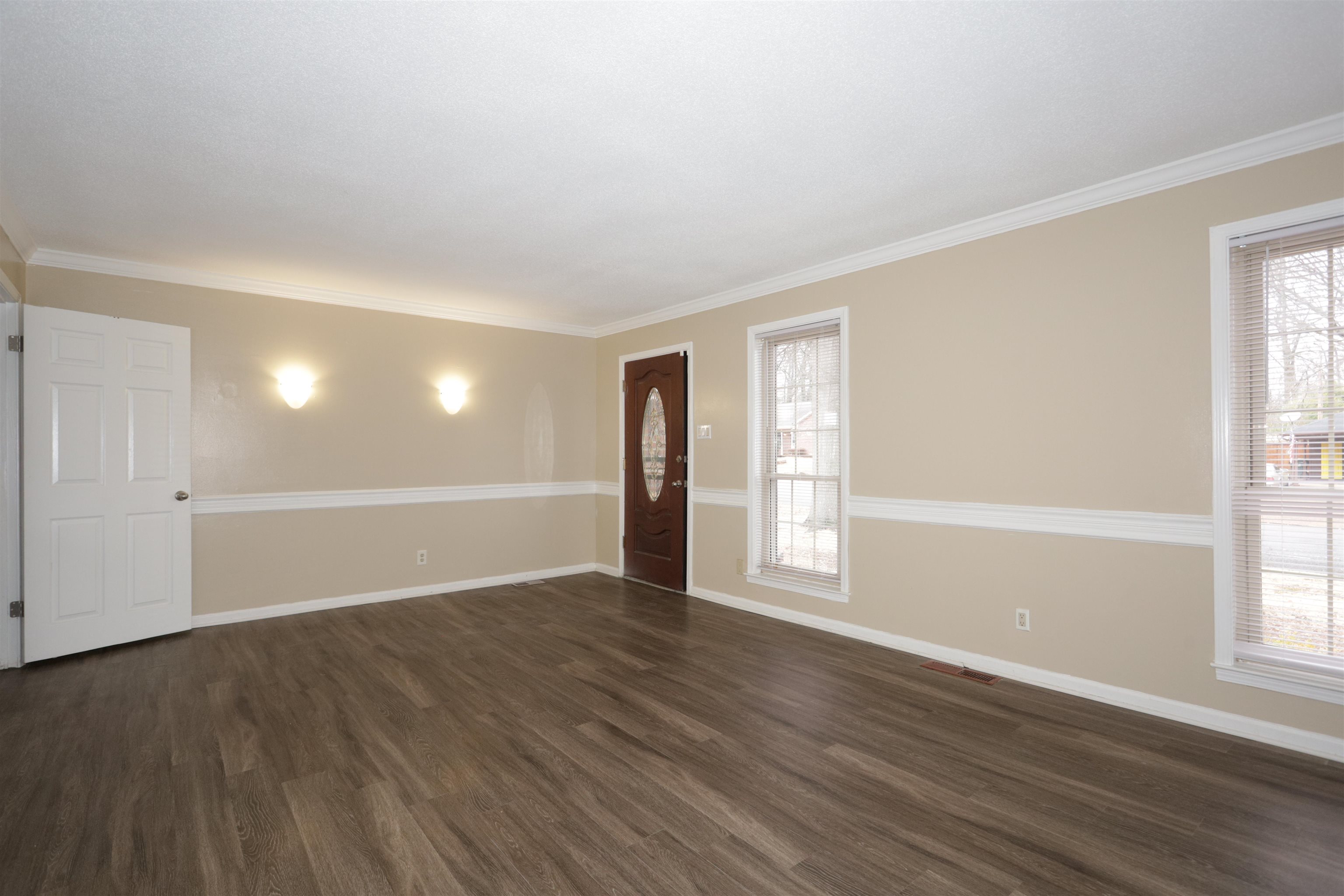 3272 Powers Road Memphis, TN 38128 - Photo 9 of 23 an empty room with wooden floor and windows