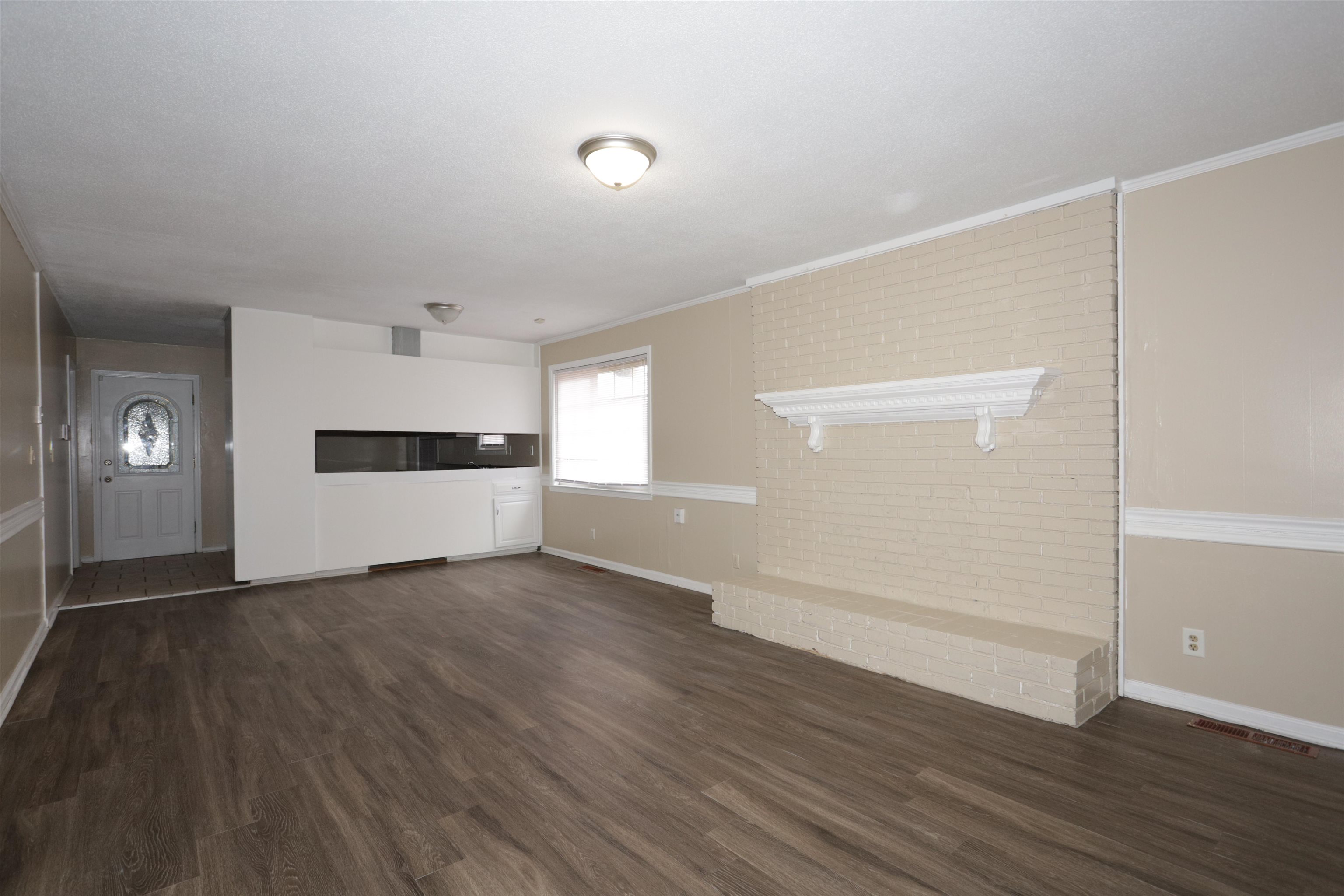 3272 Powers Road Memphis, TN 38128 - Photo 10 of 23 a view of empty room with wooden floor