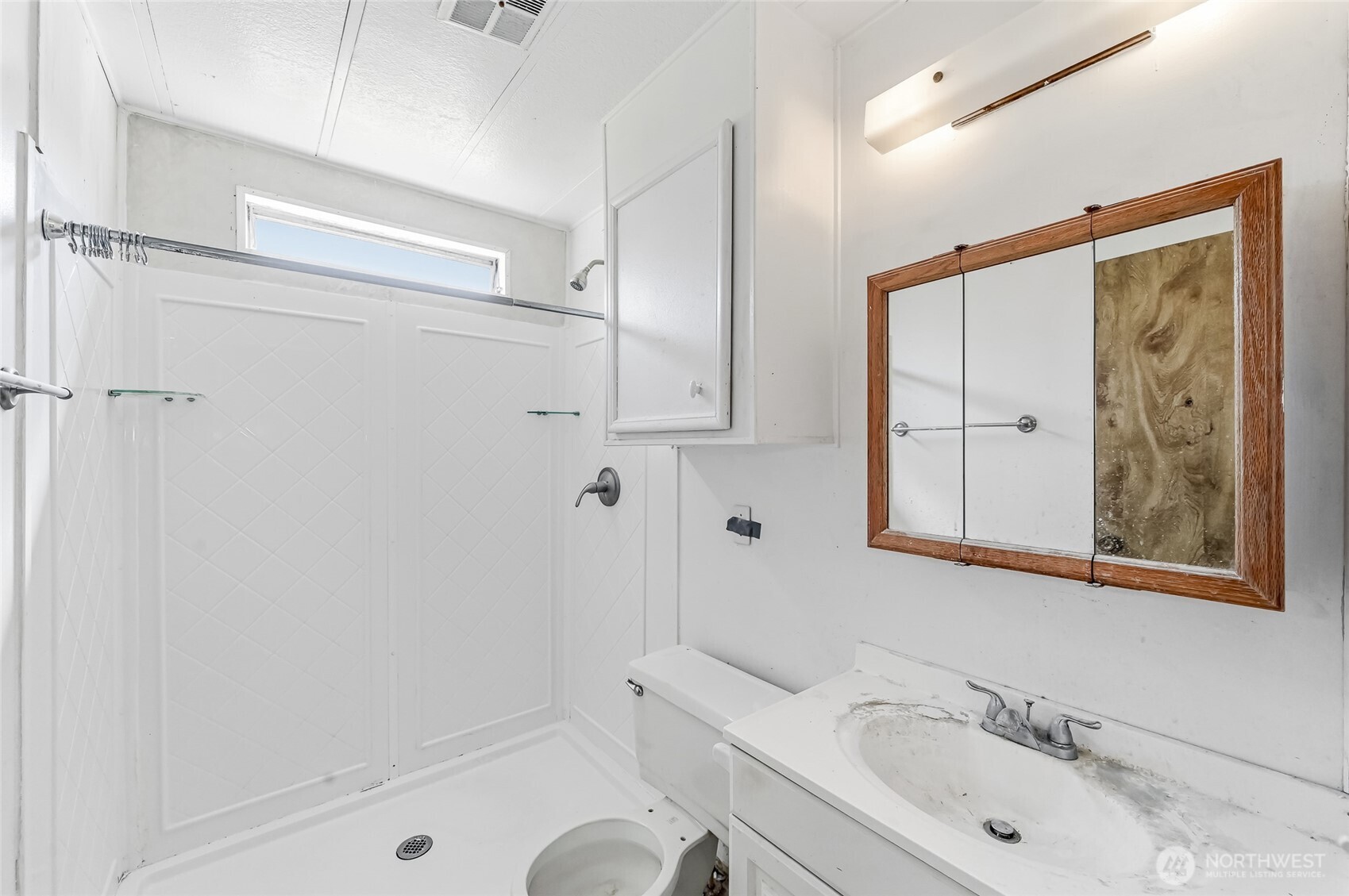 32711 Commission Avenue Black Diamond, WA 98010 - Photo 14 of 34 a bathroom with a bathtub shower sink vanity and mirror