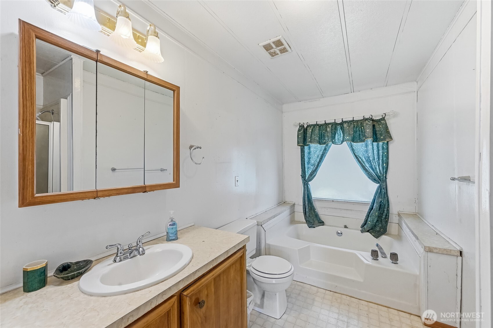 32711 Commission Avenue Black Diamond, WA 98010 - Photo 17 of 34 a bathroom with a sink a toilet and a mirror